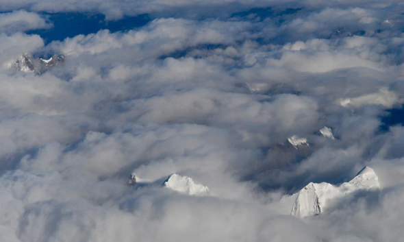 The aerial photo taken on Sept. 15, 2013 shows the scenery of snow mountains of the Qinghai-Tibet Plateau in southwest China's Tibet Autonomous Region. (Xinhua/Purbu Zhaxi)