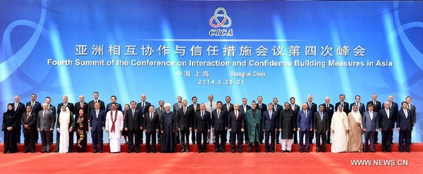 Chinese President Xi Jinping (C) poses for a group photo with world leaders and representatives attending the fourth summit of the Conference on Interaction and Confidence Building Measures in Asia (CICA) in Shanghai, May 21, 2014. (Xinhua/Ma Zhancheng) 