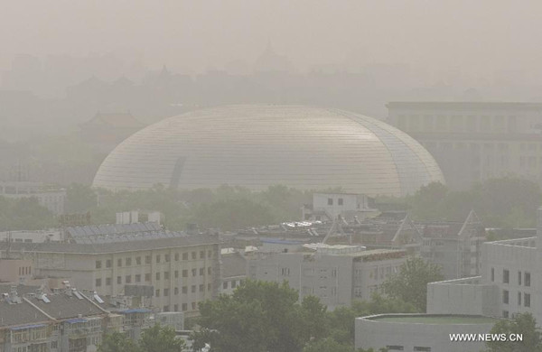 The National Center for Performing Arts, one of Beijing's landmarks, is shrouded in sand and dust in Beijing, capital of China, May 27, 2014. (Xinhua/Wang Huaigui)