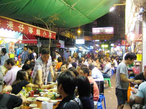 Hong Kong's outdoor street food stalls continue to be celebrated for their traditional dishes and festive atmosphere.