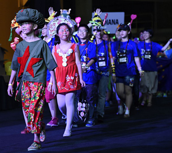 Delegates for team China enter the arena as part of the welcome ceremony during the 2014 Destination Imagination global final celebration at Thompson-Boling Arena, Wednesday, May 21, 2014. (AMY SMOTHERMAN BURGESS/NEWS SENTINEL)