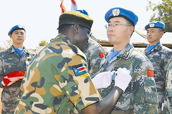 The picture shows a theatre commander of the government forces of South Sudan is wearing the 