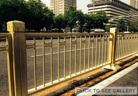 Photo taken on May 9, 2014 shows newly-placed golden road barriers along Chang'an Avenue in Beijing. The new barriers are more impact-resistant compared to former white ones. [Photo/CFP]