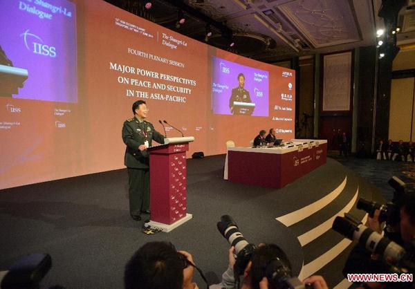 Wang Guanzhong, deputy chief of the General Staff of the Chinese People's Liberation Army, speaks during the fourth plenary session of the 13th Shangri-La Dialogue in Singapore June 1, 2014, the final day of the multilateral forum focusing on security issues in Asia. (Xinhua/Then Chih Wey)