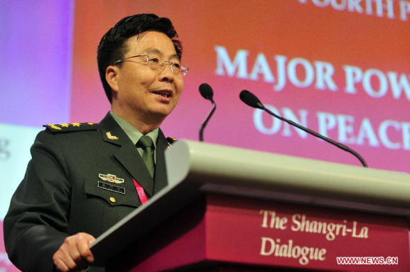 Wang Guanzhong, deputy chief of the General Staff of the Chinese People's Liberation Army, speaks during the fourth plenary session of the 13th Shangri-La Dialogue in Singapore June 1, 2014, the final day of the multilateral forum focusing on security issues in Asia. (Xinhua/Then Chih Wey)