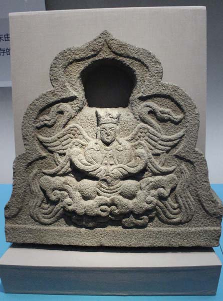 A Christian stone carving from the Yuan Dynasty (1271-1368) shows a four-winged angel. [Wang Kaihao/China Daily]