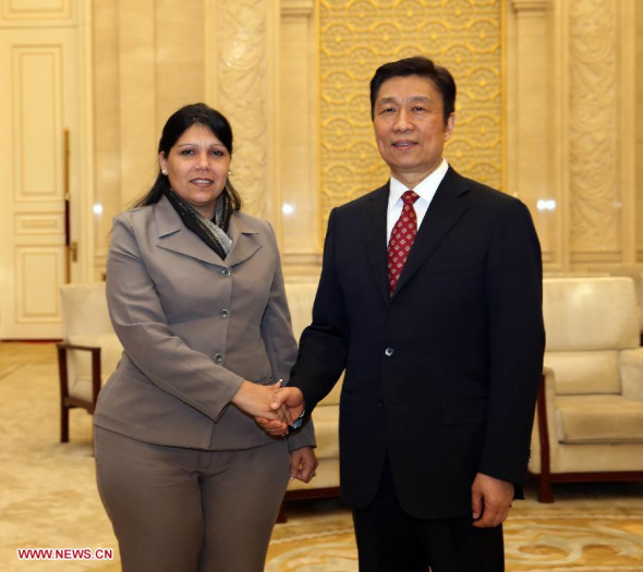 Chinese Vice President Li Yuanchao (R), also a member of the Political Bureau of the Communist Party of China (CPC) Central Committee, meets with Yuniasky Crespo, first secretary of the National Committee of the Communist Youth Union of Cuba, in Beijing, capital of China, June 5, 2014. (Xinhua/Liu Weibing)