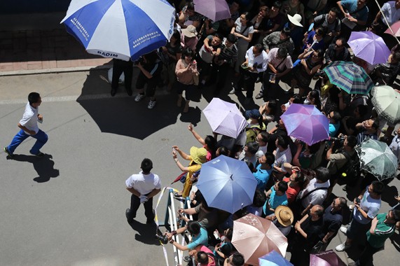 A student leaves the examination hall of the High School Affiliated to Beijing Normal University after he finished the first subject of the National College Entrance Examination on Saturday. About 9.39 million students around the country registered for the test this year. Wang Jing / China Daily