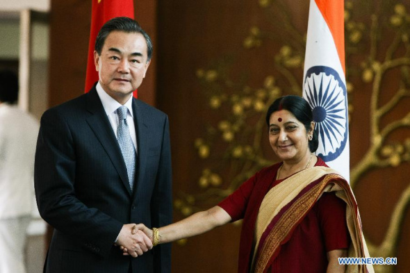 Visiting Chinese Foreign Minister Wang Yi (L) meets with Indian Minister of External Affairs Sushma Swaraj in New Delhi, India, June 8, 2014. (Xinhua/Zheng Huansong)