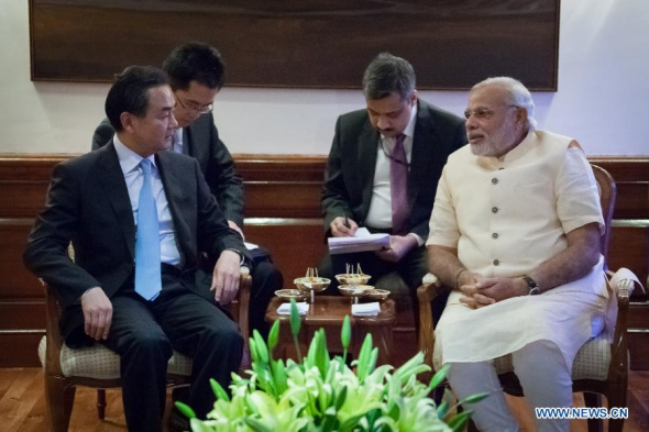Indian Prime Minister Narendra Modi (R front) meets with visiting special envoy of Chinese President Xi Jinping, Chinese Foreign Minister Wang Yi (L front) in New Delhi, capital of India, June 9, 2014. (Xinhua/Zheng Huansong)