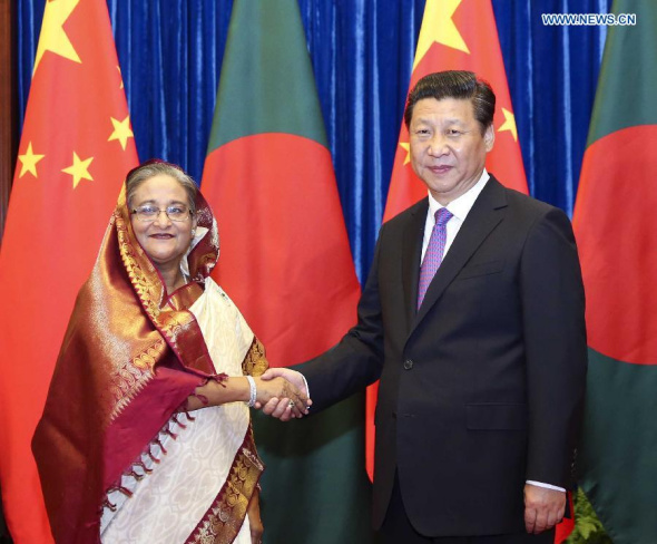 Chinese President Xi Jinping (R) meets with Bangladeshi Prime Minister Sheikh Hasina Wajed in Beijing, capital of China, June 10, 2014. (Xinhua/Ding Lin) 