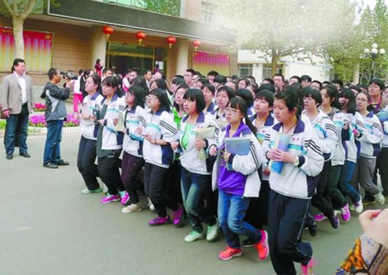 Photos from Hengshui High Schools website show students carry text books when doing morning exercises on the sport ground to take a glance while lining up. The school has roused controversy for its strict rules and exam-oriented practices which have successfully sent thousands of students to the countrys top universities.