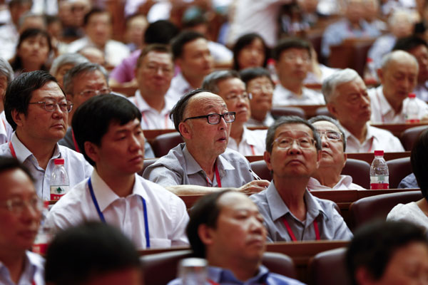 Academicians attend a meeting of the Chinese Academy of Sciences and Chinese Academy of Engineering on Tuesday. A series of reforms concerning China's academician selection and management system were released after the meeting. Feng Yongbin / China Daily
