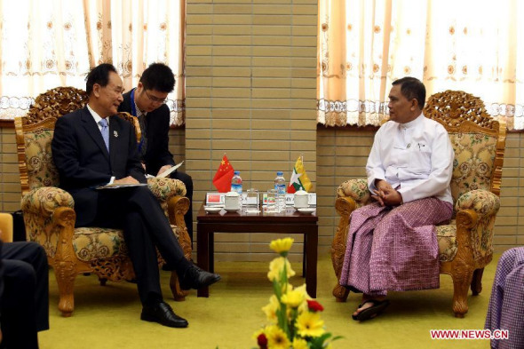 Myanmar's Minister of Information U Aung Kyi (R) meets with Chinese Minister for Information Office of the State Council Cai Mingzhao in Nay Pyi Taw, Myanmar, June 12, 2014. (Xinhua/U Aung)