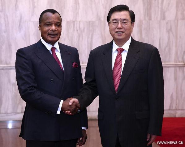 Zhang Dejiang (R), chairman of China's National People's Congress (NPC) Standing Committee, meets with Denis Sassou Nguesso, president of the Republic of Congo, before the celebration of the 50th anniversary of the establishment of diplomatic relations between China and the Republic of Congo in Beijing, capital of China, June 13, 2014. (Xinhua/Pang Xinglei)