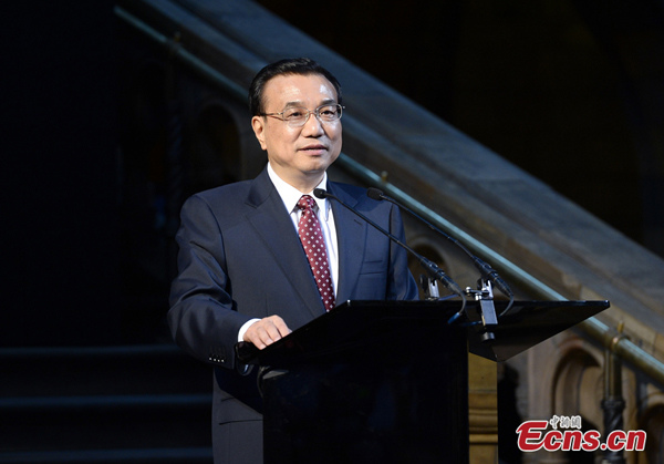 Chinese Premier Li Keqiang addresses a Sino-British business banquet at the Natural History Museum in London, June 17, 2014. [Photo: China News Service/Liu Zhen]