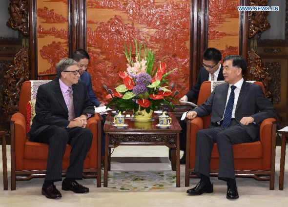 Chinese Vice Premier Wang Yang (1st R) meets with Bill Gates, co-chair of the Bill & Melinda Gates Foundation, in Beijing, capital of China, June 17, 2014. (Xinhua/Ma Zhancheng)