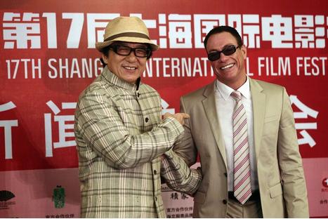 Jackie Chan welcomes his friend and film star Jean-Claude Van Damme today at the Shanghai International Film Festival. (Photo: Shanghai Daily)