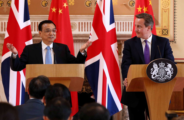 Premier Li Keqiang and British Prime Minister David Cameron meet the media on Tuesday after holding a meeting. Pang Xinglei / Xinhua