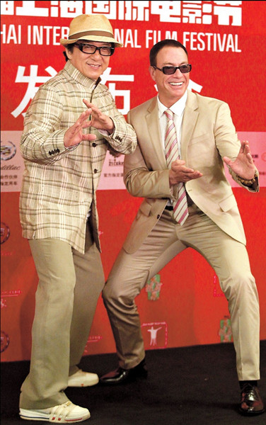 Jackie Chan poses with friend and fellow action movie star Jean-Claude Van Damme at the 17th Shanghai International Film Festival yesterday. From next year, a Jackie Chan Action Movie Gala will be a regular feature of the festival. — Dong Jun 