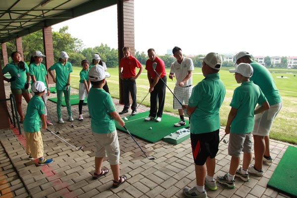Schoolchildren attend a summer golf camp in Shenzhen, Guangdong province. Provided to China Daily