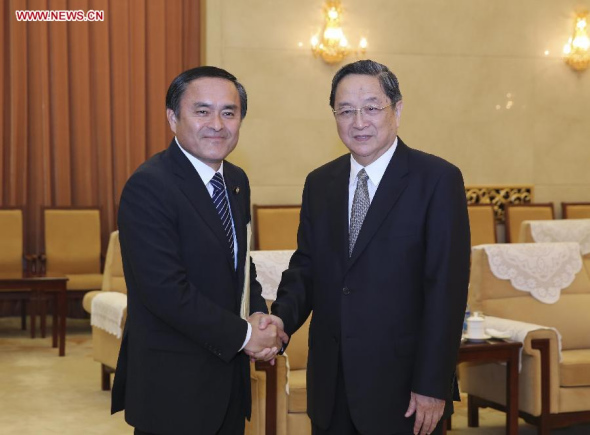 Yu Zhengsheng (R), chairman of the National Committee of the Chinese People's Political Consultative Conference, meets with a delegation from Japanese Social Democratic Party, which is led by party head Tadatomo Yoshida, in Beijing, China, June 24, 2014. (Xinhua/Ding Lin)