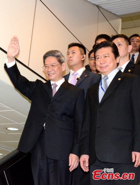 Zhang Zhijun (L front), director of the Taiwan Affairs Office of China's State Council, arrives in Taipei of China's Taiwan on June 25, 2014 for a four-day visit.  [Photo: China News Service / Chen Xiaoyuan]