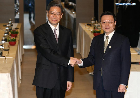 Zhang Zhijun (L), director of the Taiwan Affairs Office of China's State Council, meets with Taiwan's mainland affairs chief Wang Yu-chi in Taipei, southeast China's Taiwan, June 25, 2014. It was their second meeting this year. Wang visited the mainland in February. (Xinhua/Wang Shen)