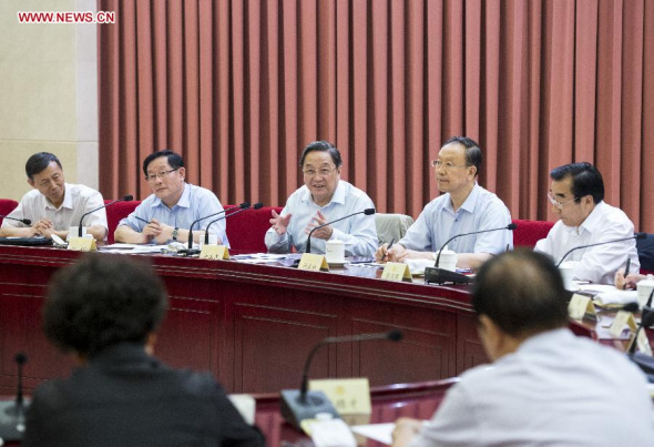 Yu Zhengsheng (3rd L), chairman of the National Committee of the Chinese People's Political Consultative Conference (CPPCC), presides over a biweekly symposium of the CPPCC in Beijing, capital of China, June 26, 2014. (Xinhua/Wang Ye)