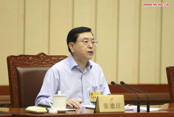 Zhang Dejiang, chairman of the Standing Committee of China's National People's Congress (NPC), presides over the closing meeting of the ninth session of the 12th NPC Standing Committee in Beijing, capital of China, June 27, 2014. (Xinhua/Ding Lin)