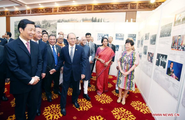Chinese Vice President Li Yuanchao (1st L front), Myanmar President U Thein Sein (2nd L front) and Indian Vice President Mohammad Hamid Ansari jointly attend a photo exhibition marking the 60th anniversary of the Five Principles of Peaceful Coexistence in Beijing, China, June 29, 2014. (Xinhua/Yao Dawei) 
