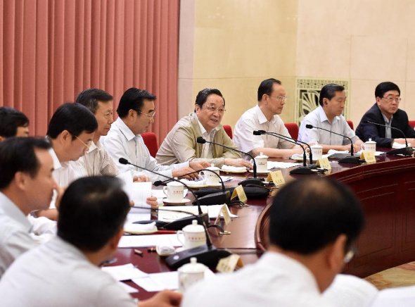 Yu Zhengsheng (4th R), chairman of the National Committee of the Chinese People's Political Consultative Conference (CPPCC), presides over a CPPCC National Committee symposium on deepening the reform of judicial system, in Beijing, China, July 3, 2014. (Xinhua/Liu Jiansheng)