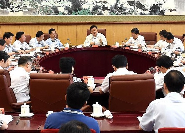 Liu Yunshan (C rear), a Standing Committee member of the Political Bureau of the Communist Party of China (CPC) Central Committee, presides over a meeting of the leading group of the Party's ongoing mass-line campaign in Beijing, China, July 5, 2014. (Xinhua/Liu Jiansheng) 