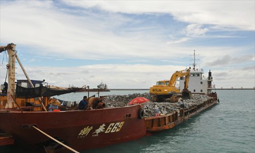 Construction equipment is shipped to the booming city of Sansha, Hainan province. Photo: Wang Zhefeng/GT