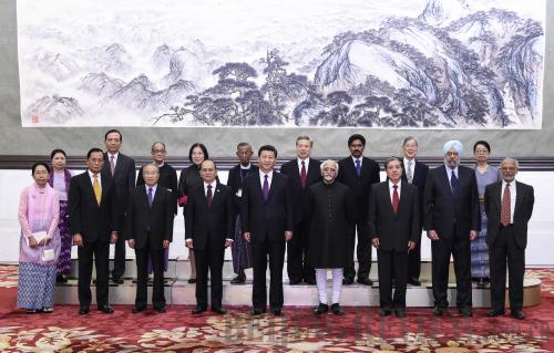 REUNION: Chinese President Xi Jinping, Myanmar's President U Thein Sein (fourth left, front row) and Indian Vice President Mohammad Hamid Ansari (fourth right, front row) pose with other participants at a conference marking the 60th anniversary of the Five Principles of Peaceful Coexistence in Beijing on June 28 (LI XUEREN)