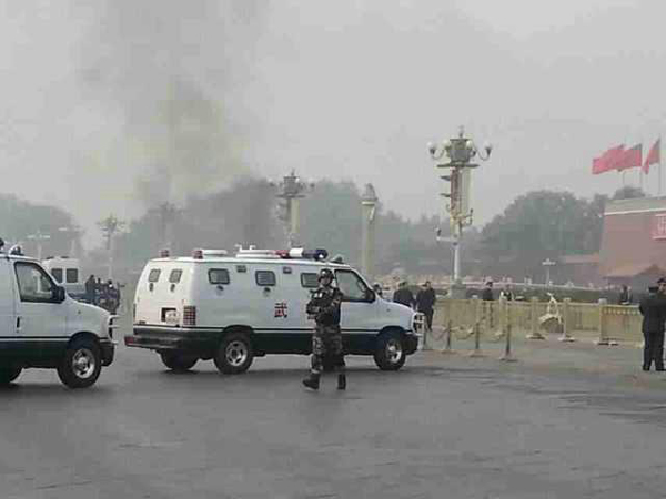 A policeman patrols after a car bomb targeted a crowd at Tian'anmen Square in Beijing on Oct 28, 2013. [Photo Provided to China Daily]