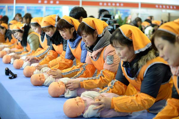 Chinese yue sao - nannies for baby and mother in the first months after birth - show their skills at a job fair in February. Many Chinese want to have a baby during this Year of the Horse, increasing demand for the nannies. He Junchang / Xinhua