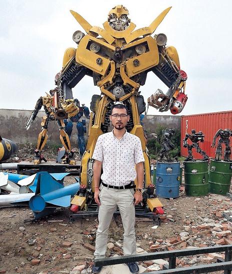 Li Weilei pictured with some of his Transformers.  Ti Gong/Shanghai Daily