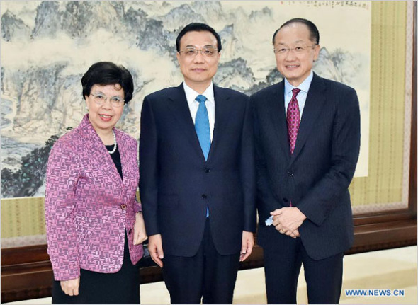 Chinese Premier Li Keqiang (C) meets with World Bank President Jim Yong Kim (R) and Margaret Chan, director-general of the World Health Organization (WHO), in Beijing, capital of China, July 8, 2014. [Photo: Xinhua]
