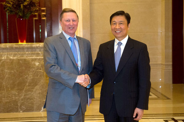 Vice-President Li Yuanchao (right) shakes hands with visiting Russian Presidential Chief of Staff Sergei Ivanov on Thursday in Guiyang, Guizhou province. Ivanov was in China to attend the Eco Forum Global Annual Conference 2014 in Guiyang. Ou Dongqu / Xinhua