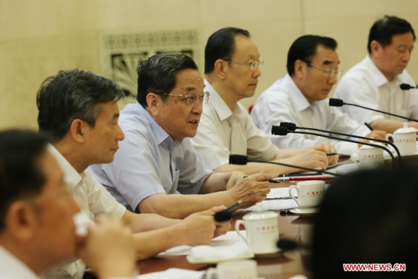 Yu Zhengsheng (3rd L), chairman of the National Committee of the Chinese People's Political Consultative Conference (CPPCC), presides over a biweekly symposium of the CPPCC in Beijing, capital of China, July 10, 2014. The symposium was about water quality protection of the mid-line of the south-north water diversion project. (Xinhua/Liu Weibing)