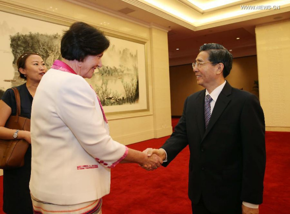 Chinese State Councilor and Minister of Public Security Guo Shengkun (R) meets with Anne Tolley, Police Minister of New Zealand, in Beijing, China, July 14, 2014. (Xinhua/Liu Weibing)
