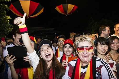 Football fans cheer for Germany at a screening of the World Cup final at the German embassy in Beijing early Monday morning, Beijing time. Photo: Li Hao/ GT
