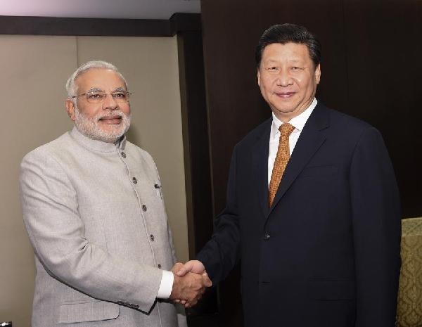 Chinese President Xi Jinping meets with Indian Prime Minister Narendra Modi in Brazil, July 14. [Photo/Xinhua] 