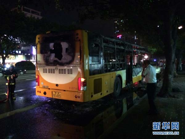 A bus catches fire in Guangzhou, capital of South China's Guangdong province, July 15, 2014.[Photo/Xinhua] 