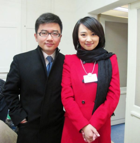 File photo shows Ouyang Zhiwei (R) and Rui Chengang posing for a photo. [Photo: Xinhua] 