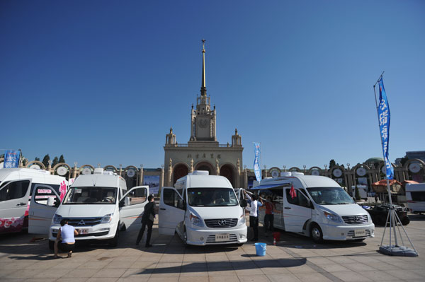Different brands of recreational vehicles are displayed at the Beijing Exhibition Center during the All In Caravaning Expo 2014. Photos by Zou Hong / China Daily