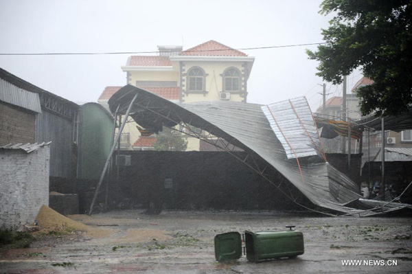 A shed is blown down in Zhanjiang City of south China's Guangdong Province, July 18, 2014. Super typhoon Rammasun made its landfall in Zhanjiang at 7:30 p.m. Friday, the provincial meteorological bureau said. This was the second landfall of Typhoon Rammasun in China's coastal areas within four hours. (Xinhua/Liang Xu)