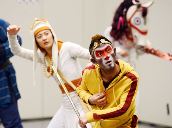 Actors performing as Sun Wukong, otherwise known as the Monkey King, and Tang Seng, otherwise known as Monk Xuanzang, from the acrobatic musical Monkey: Journey to the West rehearse in New York, US, on June 24, 2013. The show combines western pop music with Chinese ancient classic culture. The show is directed by Chen Shizheng and adapted from the Chinese classic Journey to the West.[Photo/Xinhua]