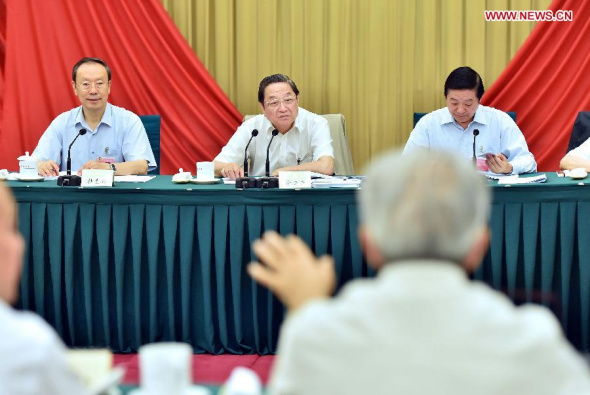  Yu Zhengsheng (C back), chairman of the National Committee of the Chinese People's Political Consultative Conference (CPPCC), presides over and addresses a CPPCC special symposium on streamlining the public cultural service system, in Beijing, capital of China, July 22, 2014. (Xinhua/Li Tao)